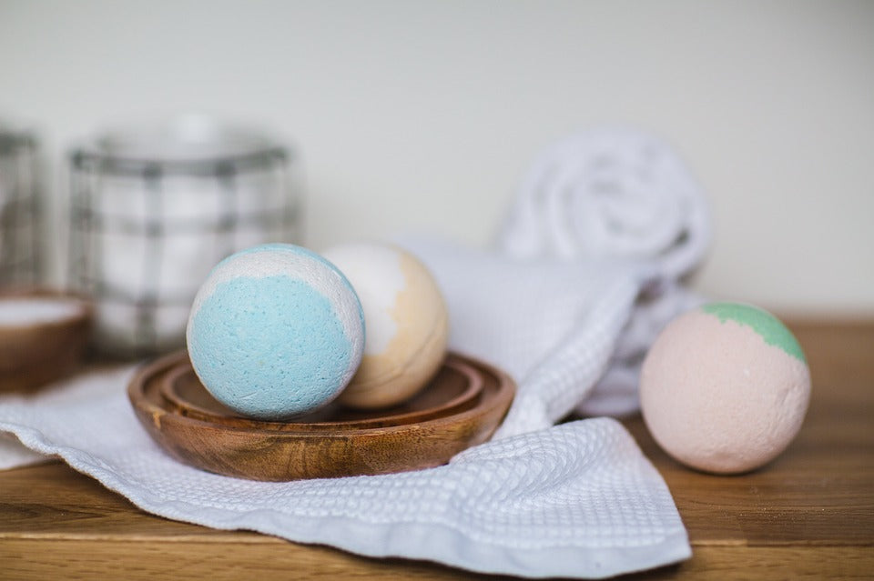 Handmade coloured bath bambs in a bathroom
