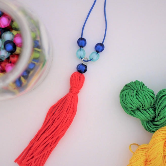 Make your own fringe beaded necklaces, red embroidery thread with blue beads