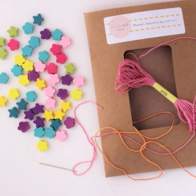 Bead necklace making craft kit includes wooden beads, needle and thread