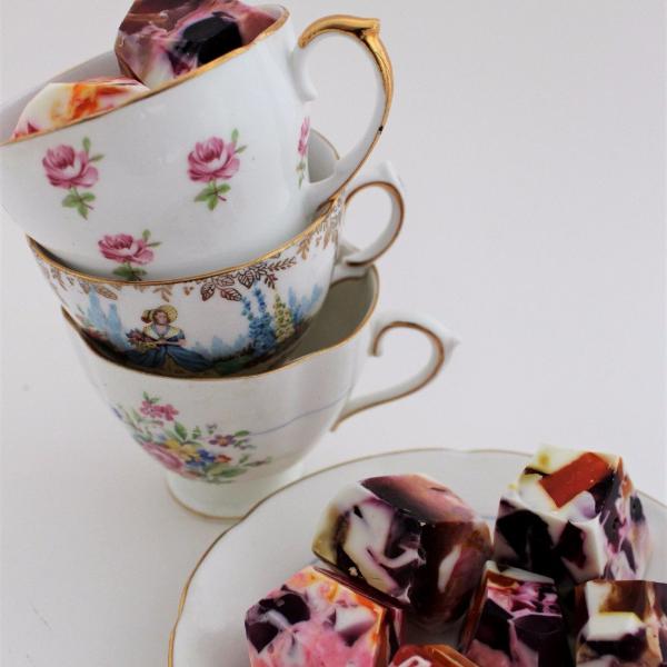 Handmade soap in a tea saucer and tea cup. 