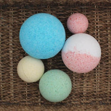 Hand made bath bombs in pink, blue, white and yellow