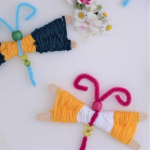 Hand made butterflies with blue, yellow and white yarn